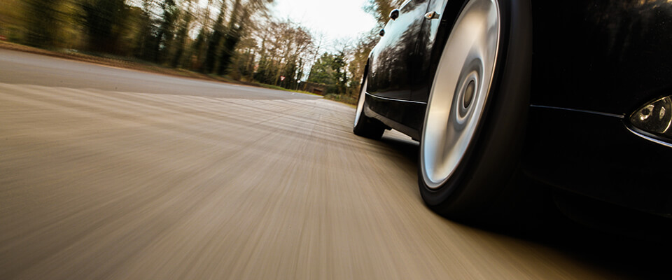 Car speeding down a country road