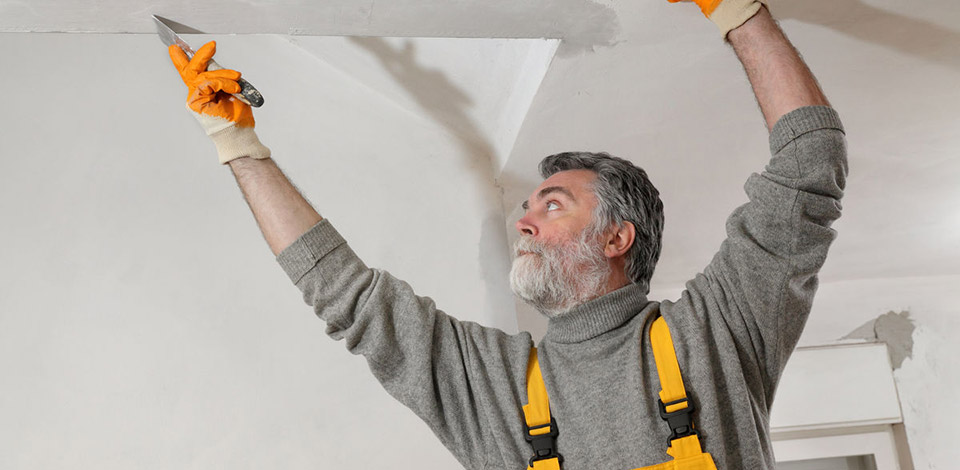Man repairing a ceiling