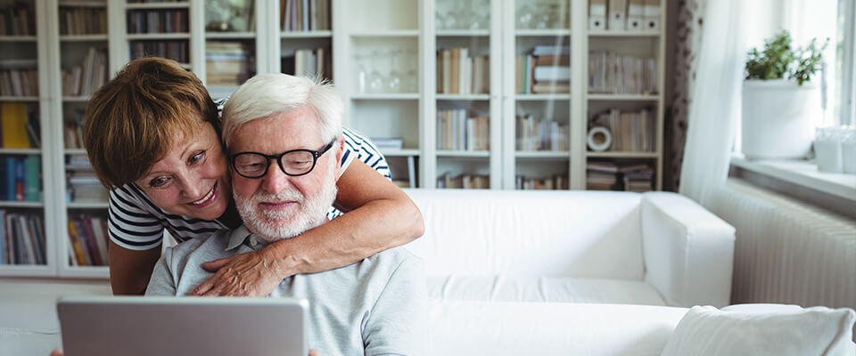 Senior couple using digital tablet