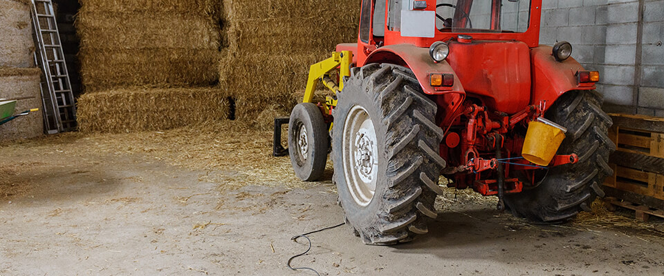 Tractor parked in hay shed