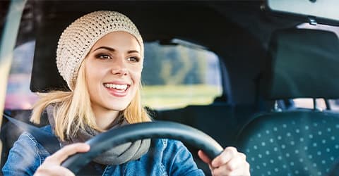 Happy woman driving