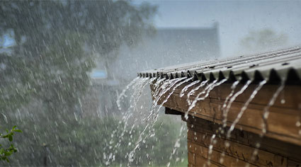 Heaving rain on house gutters